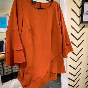 Cross hem rust blouse
